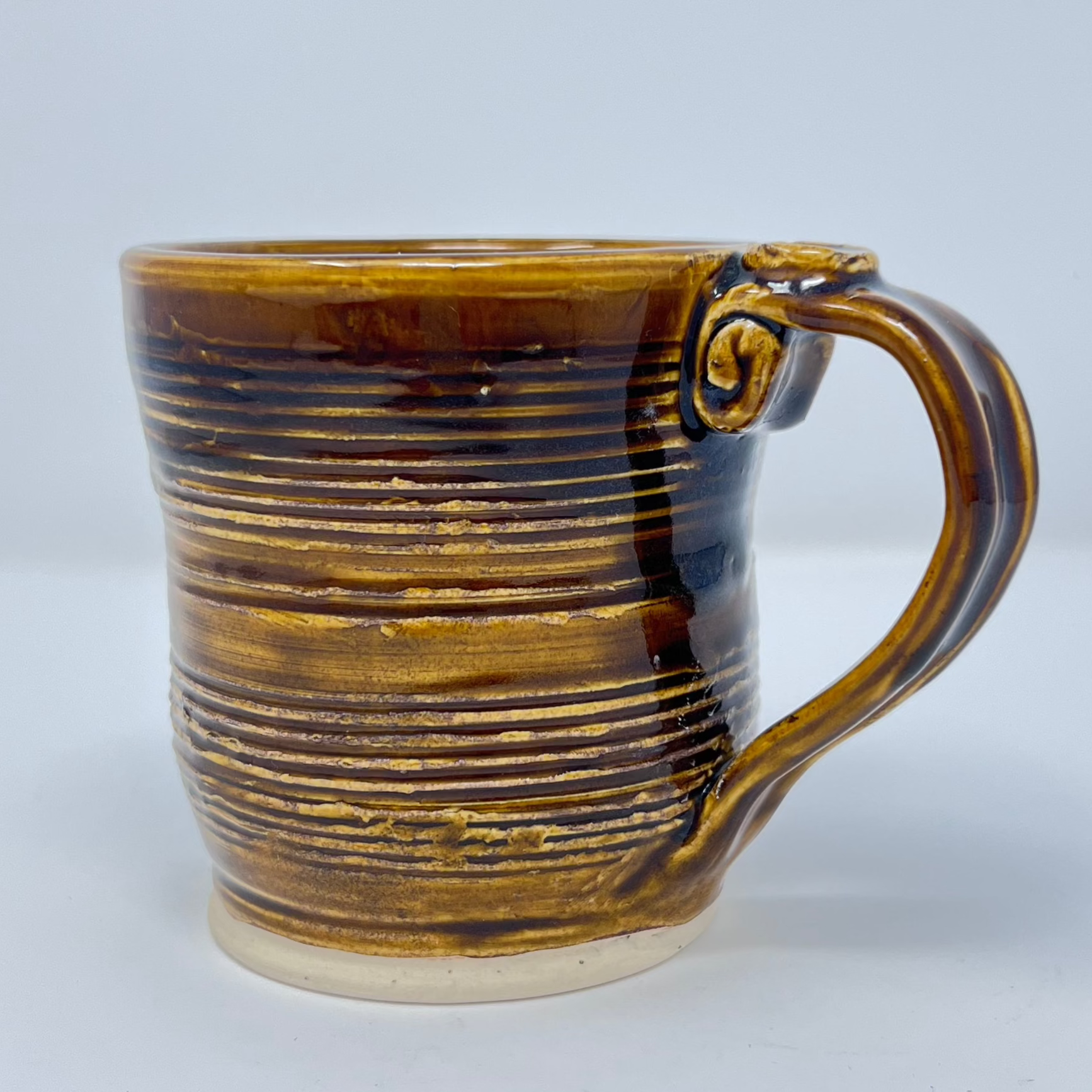 Handmade Ceramic Coffee Mug - Textured Clay with Dark Caramel Glazing