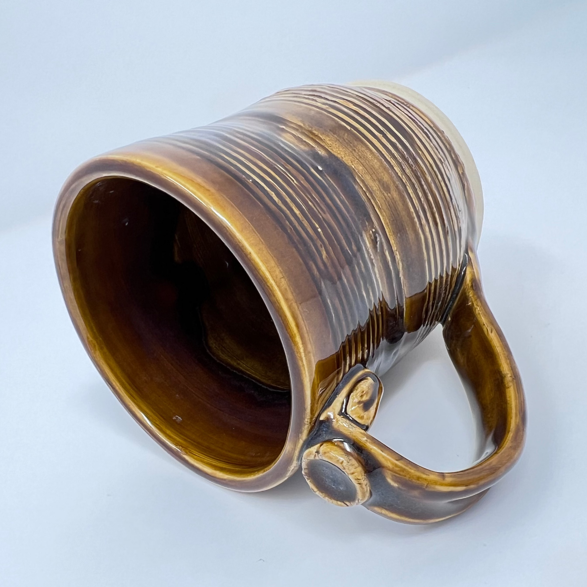 Handmade Ceramic Coffee Mug - Textured Clay with Dark Caramel Glazing - Side view