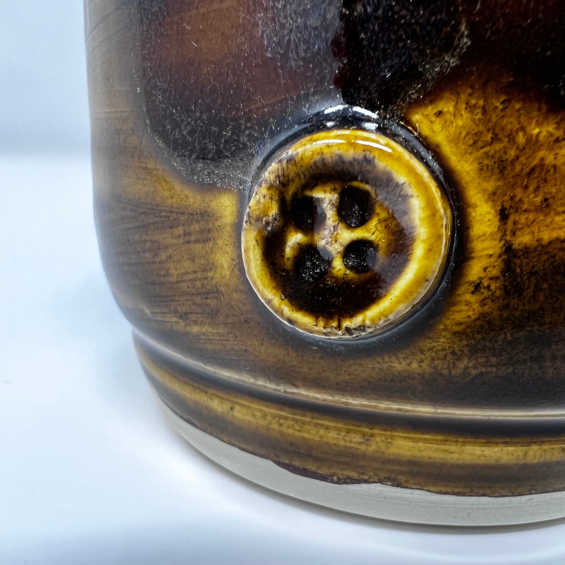 Handmade Ceramic Coffee Mug - Button with Drippy Dark Caramel Glazing - Enlarged Button view