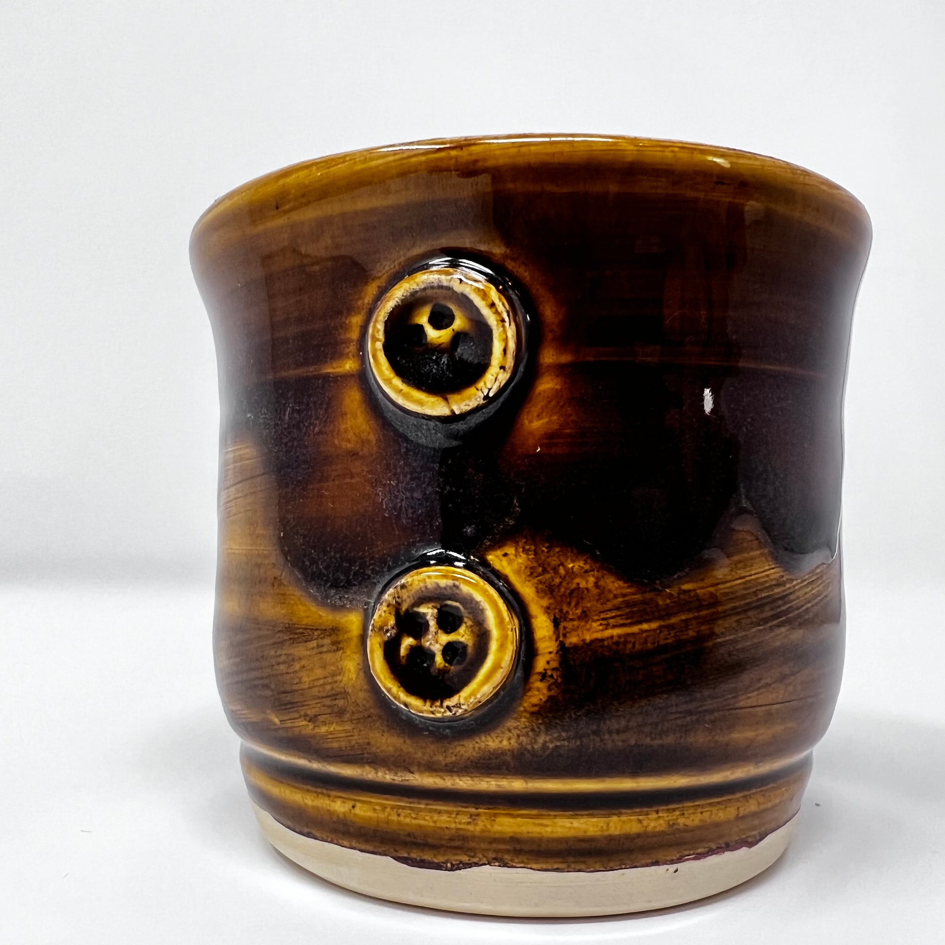 Handmade Ceramic Coffee Mug - Button with Drippy Dark Caramel Glazing - Front view with buttons