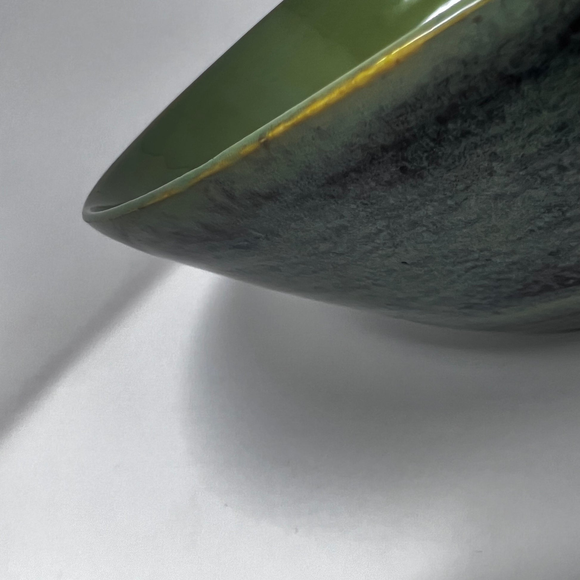 Handmade Pottery Bowl with Aqua Seaweed Glazing. Enlarged view of the unique glazing around the rim.